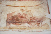 Erotic scene painted above the doorway of the room in the brothel